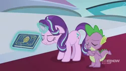 Size: 1280x720 | Tagged: safe, derpibooru import, screencap, spike, starlight glimmer, dragon, pony, unicorn, memories and more, spoiler:memories and more, spoiler:mlp friendship is forever, 9now, book, crossed arms, duo, eyes closed, levitation, magic, magic aura, scrapbook, telekinesis, winged spike