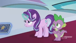 Size: 1280x720 | Tagged: safe, derpibooru import, screencap, spike, starlight glimmer, dragon, pony, unicorn, memories and more, spoiler:memories and more, spoiler:mlp friendship is forever, 9now, book, crossed arms, duo, levitation, magic, magic aura, scrapbook, telekinesis, winged spike