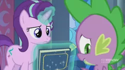 Size: 1280x720 | Tagged: safe, derpibooru import, screencap, spike, starlight glimmer, dragon, pony, unicorn, memories and more, spoiler:memories and more, spoiler:mlp friendship is forever, 9now, book, duo, levitation, magic, magic aura, scrapbook, telekinesis, unamused, winged spike, worried