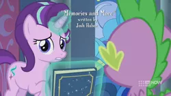 Size: 1280x720 | Tagged: safe, derpibooru import, screencap, spike, starlight glimmer, dragon, pony, unicorn, memories and more, spoiler:memories and more, spoiler:mlp friendship is forever, 9now, book, duo, levitation, looking at you, magic, magic aura, scrapbook, telekinesis, winged spike, worried