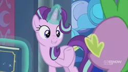 Size: 1280x720 | Tagged: safe, derpibooru import, screencap, spike, starlight glimmer, dragon, pony, unicorn, memories and more, spoiler:memories and more, spoiler:mlp friendship is forever, 9now, book, duo, levitation, looking at each other, magic, magic aura, scrapbook, smiling, telekinesis, winged spike