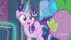 Size: 1280x720 | Tagged: safe, derpibooru import, screencap, spike, starlight glimmer, dragon, pony, unicorn, memories and more, spoiler:memories and more, spoiler:mlp friendship is forever, 9now, book, duo, levitation, looking at each other, magic, magic aura, scrapbook, smiling, telekinesis, winged spike