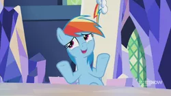 Size: 1280x720 | Tagged: safe, derpibooru import, screencap, rainbow dash, pegasus, pony, memories and more, spoiler:memories and more, spoiler:mlp friendship is forever, 9now, hooves up, mid-blink screencap, sitting, solo, who cares