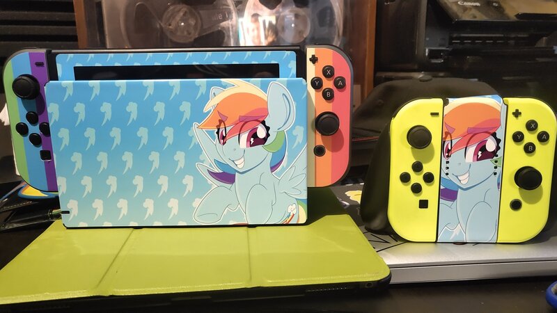 Size: 2048x1152 | Tagged: safe, artist:partylikeanartist, derpibooru import, rainbow dash, pegasus, pony, console, irl, nintendo, nintendo switch, photo, switch