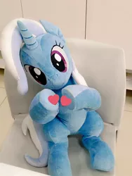 Size: 768x1024 | Tagged: safe, artist:nekokevin, derpibooru import, trixie, pony, unicorn, chair, female, heart, hooves together, irl, looking at you, mare, photo, plushie, sitting, smiling, solo, underhoof