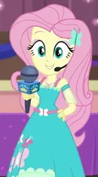 Size: 329x590 | Tagged: safe, derpibooru import, screencap, fluttershy, best in show: the victory lap, equestria girls, equestria girls series, spoiler:eqg series (season 2), clothes, cropped, cute, dress, geode of fauna, hand on hip, looking at you, magical geodes, microphone, shyabetes, smiling, smiling at you, solo