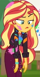 Size: 387x742 | Tagged: safe, derpibooru import, screencap, sunset shimmer, equestria girls, equestria girls series, sunset's backstage pass!, spoiler:eqg series (season 2), belt, canvas, clothes, cropped, cute, female, forest background, geode of empathy, grass, jacket, jewelry, leather jacket, lidded eyes, long sleeves, looking down, magical geodes, music festival outfit, necklace, outdoors, paint, pants, raised eyebrow, shimmerbetes, shirt, unamused, wavy hair