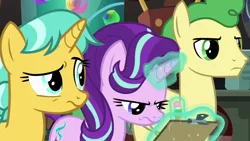 Size: 1920x1080 | Tagged: safe, derpibooru import, screencap, citrine spark, fire quacker, huckleberry, starlight glimmer, pegasus, pony, unicorn, a horse shoe-in, clipboard, displeased, female, friendship student, glowing horn, hair flip, horn, laboratory, levitation, magic, magic aura, male, mare, narrowed eyes, raised eyebrow, stallion, starlight is not amused, telekinesis, trio, unamused, writing, young mare