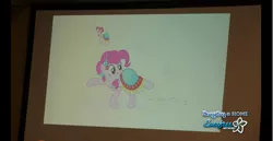 Size: 1366x704 | Tagged: safe, artist:cooltomorrowkid, artist:ellybethe, derpibooru import, pinkie pie, earth pony, pony, bronycon, journey of the spark, alternate hairstyle, clothes, concept art, convention, dress, everfree network, female, mare, photo, raised hoof, raised leg, signature, smiling