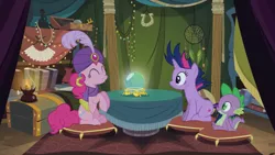 Size: 2100x1181 | Tagged: safe, derpibooru import, screencap, pinkie pie, spike, twilight sparkle, dragon, earth pony, pony, unicorn, it's about time, crystal ball, cushion, eyes closed, female, fortune teller, madame pinkie, male, mare, table, tent, trio, turban, unicorn twilight