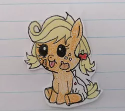 Size: 750x662 | Tagged: safe, artist:agirlwholovesmlp, derpibooru import, applejack, earth pony, pony, apple family reunion, baby, baby pony, babyjack, cute, diaper, female, filly, foal, freckles, jackabetes, lined paper, sitting, tongue out, traditional art, younger