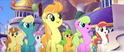 Size: 1920x808 | Tagged: safe, derpibooru import, screencap, cantaloupe (character), cornsilk, dawn sunrays, nougat praliné, unnamed character, unnamed pony, earth pony, pony, unicorn, my little pony: the movie, background pony, balloon, bow, canterlot, clones, confetti, female, friendship festival, group, hair bow, hairclip, mane bow, marching, mare, raised hoof, singing, we got this together
