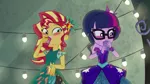 Size: 1280x720 | Tagged: safe, derpibooru import, screencap, sci-twi, sunset shimmer, twilight sparkle, equestria girls, legend of everfree, bare shoulders, blushing, clothes, dress, duo, duo female, female, holding shoes, shoes, sleeveless, strapless