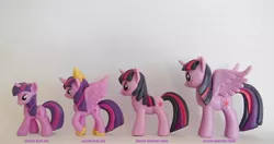 Size: 1000x529 | Tagged: safe, derpibooru import, official, twilight sparkle, twilight sparkle (alicorn), alicorn, pony, unicorn, blind bag, comparison, factory error, figure, size comparison, toy