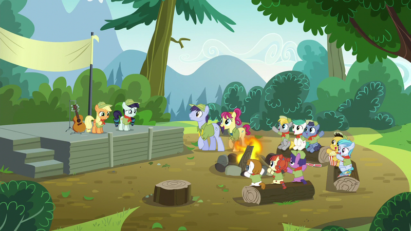 Size: 1280x720 | Tagged: safe, derpibooru import, screencap, applejack, coloratura, lavandula, nature walk, paige (character), russell, shady blues, soft ice, summer joy, trailhead, unnamed character, unnamed pony, wild card, pony, the mane attraction, archie comics, background pony, camp friendship, cheering, clothes, colt, comic book, female, filly, food, glasses, hat, log, male, neckerchief, popcorn, scout uniform, shirt, smiling, up