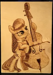 Size: 1024x1459 | Tagged: safe, artist:horseez, derpibooru import, octavia melody, earth pony, pony, bipedal, bipedal leaning, bow (instrument), bowtie, cello, cello bow, craft, female, hoof hold, leaning, mare, musical instrument, pyrography, solo, traditional art, woodwork