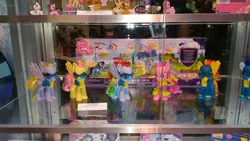 Size: 3264x1836 | Tagged: safe, derpibooru import, official, derpy hooves, fluttershy, pinkie pie, rainbow dash, soarin', spitfire, earth pony, pegasus, pony, cheerleader, cheerleader outfit, clothes, female, goggles, male, mare, merchandise, sdcc 2016, stallion, that one nameless background pony we all know and love, uniform, wonderbolts, wonderbolts uniform
