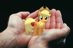 Size: 1200x796 | Tagged: safe, artist:barbra, derpibooru import, applejack, pony, appletini, in goliath's palm, irl, micro, photo, ponies in real life, tiny, tiny ponies, vector