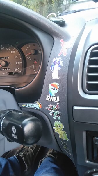 Size: 1214x2160 | Tagged: :'(, car, dashboard, derpibooru import, hyundai, hyundai accent, irl, lyra heartstrings, merchandise, oc, photo, rainbow dash, russia, safe, sticker, vinyl scratch