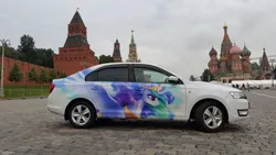 Size: 1024x576 | Tagged: artist:cannibalus, car, decal, derpibooru import, irl, itasha, kremlin, moscow, photo, princess celestia, red square, russia, safe, skoda, skoda rapid, st. basil's cathedral