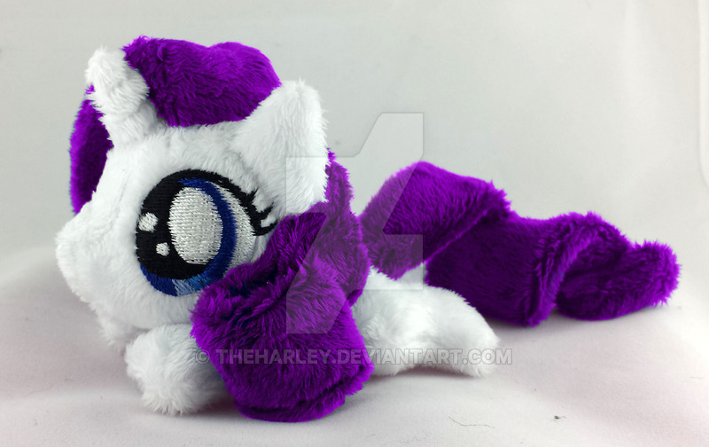 Size: 800x504 | Tagged: artist:theharley, beanie (plushie), derpibooru import, female, filly, filly rarity, irl, mini, photo, plushie, prone, rarity, safe, solo, watermark, younger