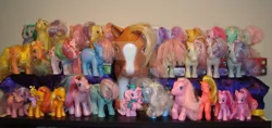 Size: 900x425 | Tagged: animal, applejack, applejack (g1), artist:faerie-starv, berry bright, blossom, blue belle, bowtie (g1), brushable, bumblesweet, butterscotch (g1), christmas, collection, cotton candy (g1), derpibooru import, dream blue, ember (g1), g1, g2, g3, holiday, honeybuzz, irl, jazz matazz, lemon drop, minty (g1), my pretty pony, ornament, parasol (g1), peachy, photo, pinkie pie, pinkie pie (g3), posey, rabbit, retro leap, safe, seashell (g1), snuzzle, square crossover, toy, watermark