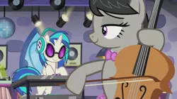 Size: 1280x720 | Tagged: safe, derpibooru import, screencap, octavia melody, vinyl scratch, earth pony, pony, unicorn, slice of life (episode), bow (instrument), bowtie, cello, cello bow, electric piano, headphones, musical instrument, turntable