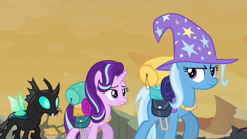 Size: 1280x720 | Tagged: safe, derpibooru import, screencap, starlight glimmer, thorax, trixie, changeling, pony, unicorn, to where and back again, clothes, hat, looking back, raised hoof, spread wings, trixie's hat, walking, wings