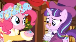 Size: 853x478 | Tagged: safe, derpibooru import, screencap, pinkie pie, snowfall frost, spirit of hearth's warming presents, starlight glimmer, pony, a hearth's warming tail, discovery family logo, pinkie's present, present, tiny, visual gag