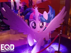 Size: 1600x1200 | Tagged: safe, derpibooru import, twilight sparkle, twilight sparkle (alicorn), alicorn, pony, my little pony: the movie, flying, glowing horn, happy, horn, irl, it's coming right at us, photo, smiling, solo, spread wings, toy fair, toy fair 2017, wings