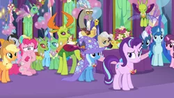 Size: 1280x720 | Tagged: safe, derpibooru import, screencap, applejack, bright smile, castle (crystal pony), discord, linky, lucky clover, mayor mare, night glider, party favor, pinkie pie, shoeshine, starlight glimmer, sugar belle, thorax, trixie, twinkleshine, changedling, changeling, crystal pony, earth pony, pony, unicorn, celestial advice, background changeling, background pony, crowd, equestrian pink heart of courage, king thorax, reformed four, twilight's castle