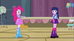 Size: 1100x618 | Tagged: safe, derpibooru import, screencap, pinkie pie, twilight sparkle, equestria girls, equestria girls (movie), balloon, boots, bowtie, bracelet, camera, chair, clothes, high heel boots, jewelry, pumpkin, shoes, skirt