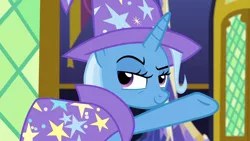 Size: 1280x720 | Tagged: safe, derpibooru import, screencap, trixie, pony, unicorn, no second prances, cape, clothes, hat, lidded eyes, raised eyebrow, solo, trixie's cape, trixie's hat