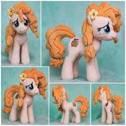 Size: 1280x1280 | Tagged: safe, artist:buttercupbabyppg, derpibooru import, pear butter, earth pony, pony, the perfect pear, beanie (plushie), blushing, flower, flower in hair, irl, photo, plushie, solo