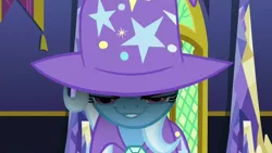 Size: 1280x720 | Tagged: cape, clothes, derpibooru import, evil grin, grin, hat, no second prances, safe, screencap, smiling, smirk, solo, trixie, trixie's cape, trixie's glare, trixie's hat