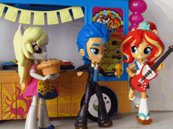 Size: 494x370 | Tagged: safe, artist:whatthehell!?, derpibooru import, edit, derpy hooves, flash sentry, sunset shimmer, equestria girls, animated, clothes, derp, doll, equestria girls minis, eqventures of the minis, food, guitar, irl, muffin, musical instrument, photo, shoes, singing, skirt, stop motion, sunset sushi, sushi, toy, truck, tuxedo