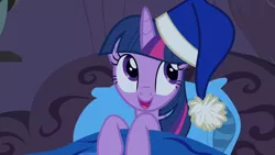 Size: 1280x720 | Tagged: safe, derpibooru import, screencap, twilight sparkle, twilight sparkle (alicorn), alicorn, pony, power ponies (episode), bed, blanket, cute, female, golden oaks library, happy, hat, hoof hold, indoors, looking away, mare, nightcap, open mouth, pillow, smiling, solo, twiabetes