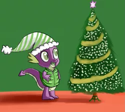 Size: 881x785 | Tagged: artist:itsthinking, christmas, christmas tree, clothes, derpibooru import, dragon, green background, hat, hearth's warming eve, holiday, idw, jacket, open mouth, safe, santa hat, simple background, smiling, solo, spike, tree