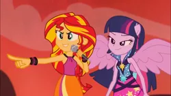 Size: 1366x768 | Tagged: safe, derpibooru import, screencap, sunset shimmer, twilight sparkle, equestria girls, rainbow rocks, >:), >:d, grin, happy, lidded eyes, microphone, pointing, ponied up, smiling, smirk, spread wings, welcome to the show, wings