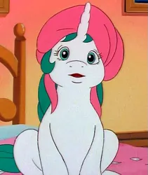 Size: 455x540 | Tagged: safe, derpibooru import, screencap, baby gusty, unicorn, my little pony 'n friends, the ghost of paradise estate, bed, cropped, g1, pillow, pillow hat, solo