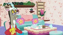 Size: 1280x720 | Tagged: clothes, couch, cup, cushion, cute, derpibooru import, discord, discordant harmony, discord's house, discute, draconequus, glasses, male, safe, screencap, solo, sweater, teacup, teapot
