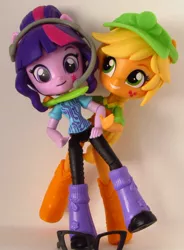 Size: 606x825 | Tagged: safe, artist:whatthehell!?, derpibooru import, applejack, sci-twi, twilight sparkle, equestria girls, boots, clothes, doll, equestria girls minis, glasses, grimderp, hat, headphones, irl, knife, photo, shoes, toy