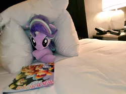 Size: 1024x767 | Tagged: safe, artist:nekokevin, derpibooru import, starlight glimmer, pony, unicorn, series:nekokevin's glimmy, babscon, bed, bedroom, crossed hooves, cute, female, glimmerbetes, irl, lamp, looking down, lying down, mare, photo, pillow, plushie, prone, solo
