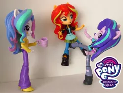 Size: 1500x1125 | Tagged: safe, artist:whatthehell!?, derpibooru import, edit, princess celestia, starlight glimmer, sunset shimmer, equestria girls, abuse, boots, clothes, cup, doll, dress, equestria girls minis, irl, jacket, kick, kicking, pants, parody, photo, principal celestia, shimmerbuse, shoes, smiley face, toy