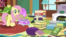 Size: 1280x720 | Tagged: safe, derpibooru import, screencap, fluttershy, pony, fluttershy leans in, book, fluttershy's cottage, gramophone, solo