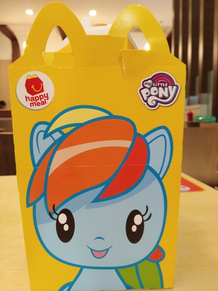 Size: 3016x4032 | Tagged: safe, derpibooru import, photographer:horsesplease, rainbow dash, box, chibi, cute, cutie mark crew, dashabetes, happy, happy meal, irl, malaysia, mcdonald's, mcdonald's happy meal toys, my little pony logo, photo, smiling, solo, toy