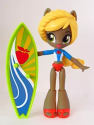 Size: 846x1128 | Tagged: safe, artist:whatthehell!?, derpibooru import, applejack, equestria girls, clothes, dark skin, doll, equestria girls minis, irl, photo, ponied up, recolor, sandals, solo, surfboard, swimsuit, toy