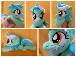 Size: 1600x1200 | Tagged: safe, artist:equinepalette, derpibooru import, lyra heartstrings, pony, unicorn, beanie (plushie), female, hand, irl, irrational exuberance, mare, photo, plushie, prone, smiling, solo