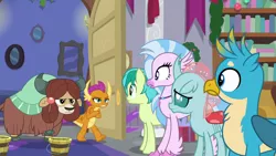 Size: 1280x720 | Tagged: safe, derpibooru import, screencap, gallus, ocellus, sandbar, silverstream, smolder, yona, changedling, changeling, classical hippogriff, dragon, earth pony, gryphon, hippogriff, pony, yak, the hearth's warming club, bow, cloven hooves, dragoness, female, hair bow, jewelry, male, monkey swings, necklace, student six, teenager