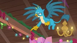 Size: 1280x720 | Tagged: safe, derpibooru import, screencap, gallus, gryphon, the hearth's warming club, claws, flying, male, paws, pointing, solo, wings